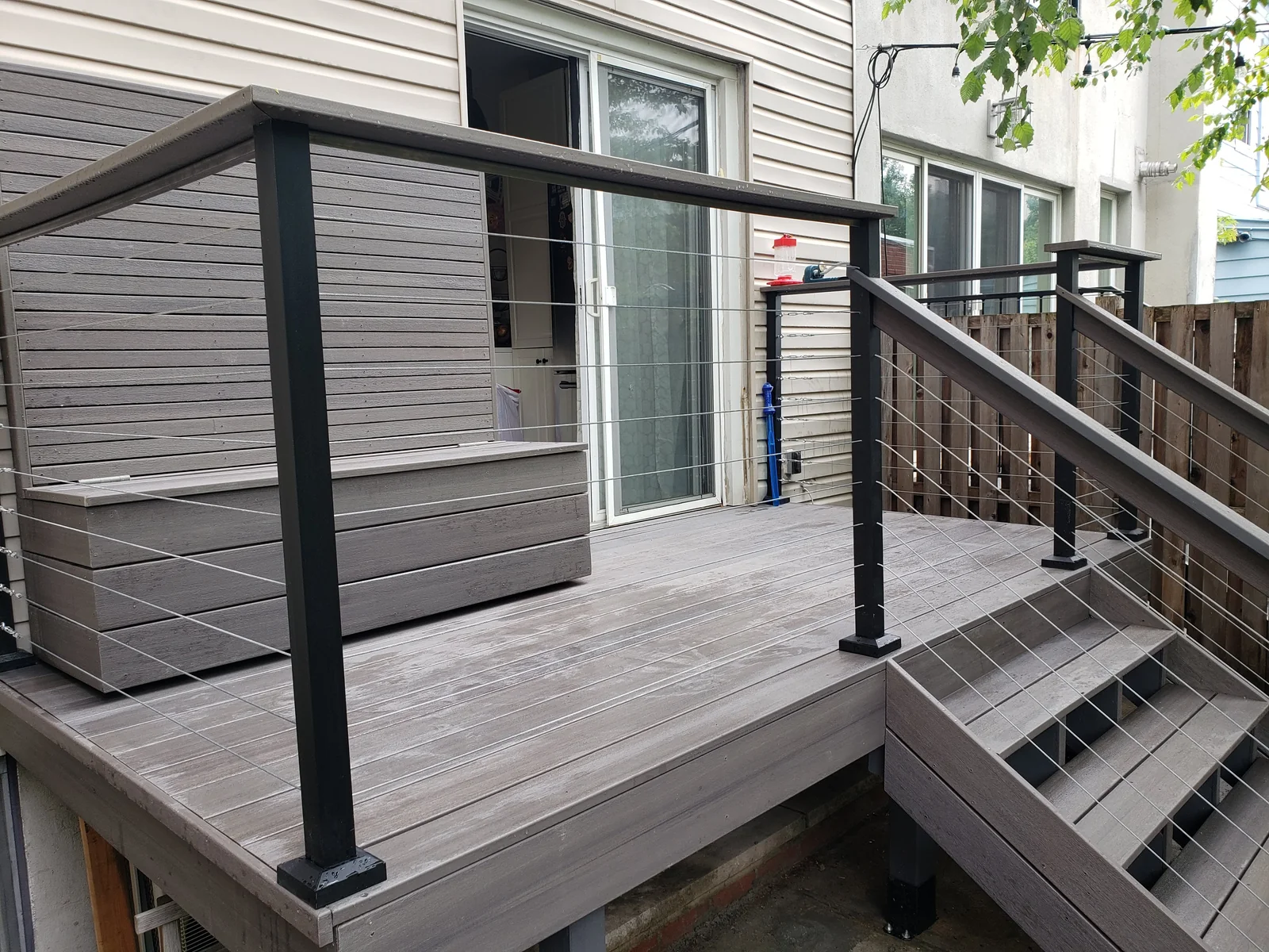 Deck entry steps cable railing by City Decks New York.