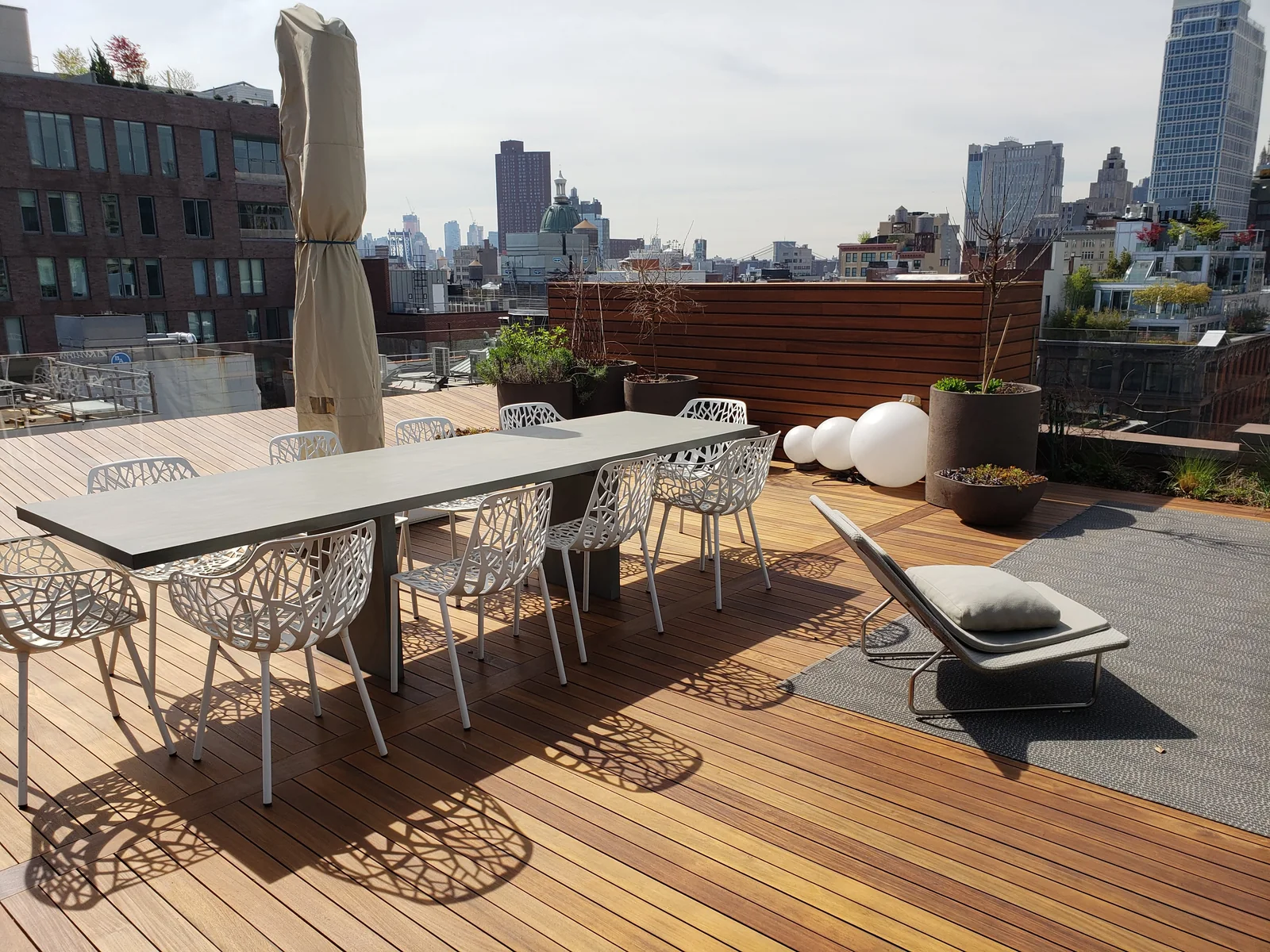 Rooftop deck dining area by City Decks New York.