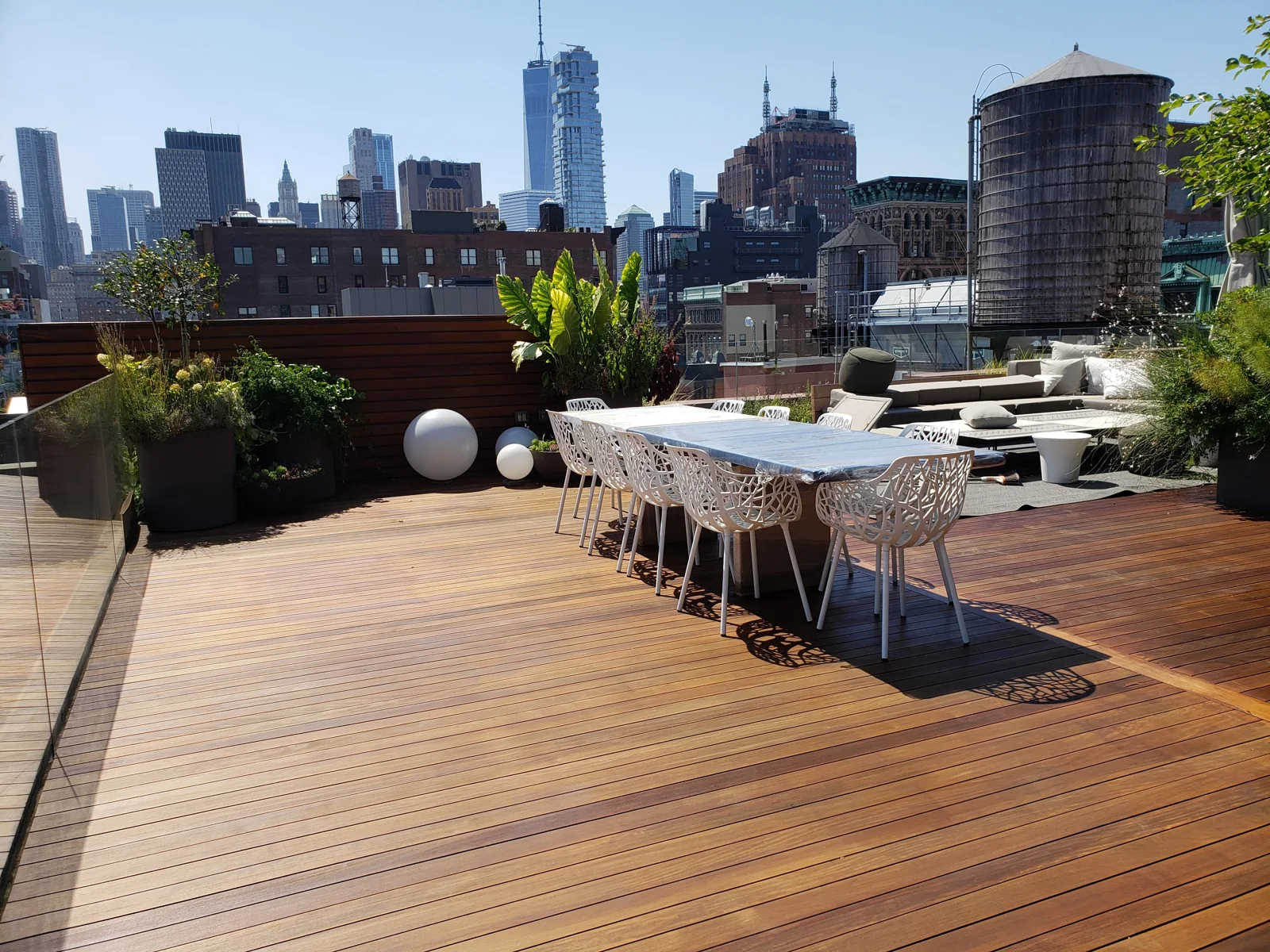 Rooftop deck outdoor dining skyline by City Decks New York.
