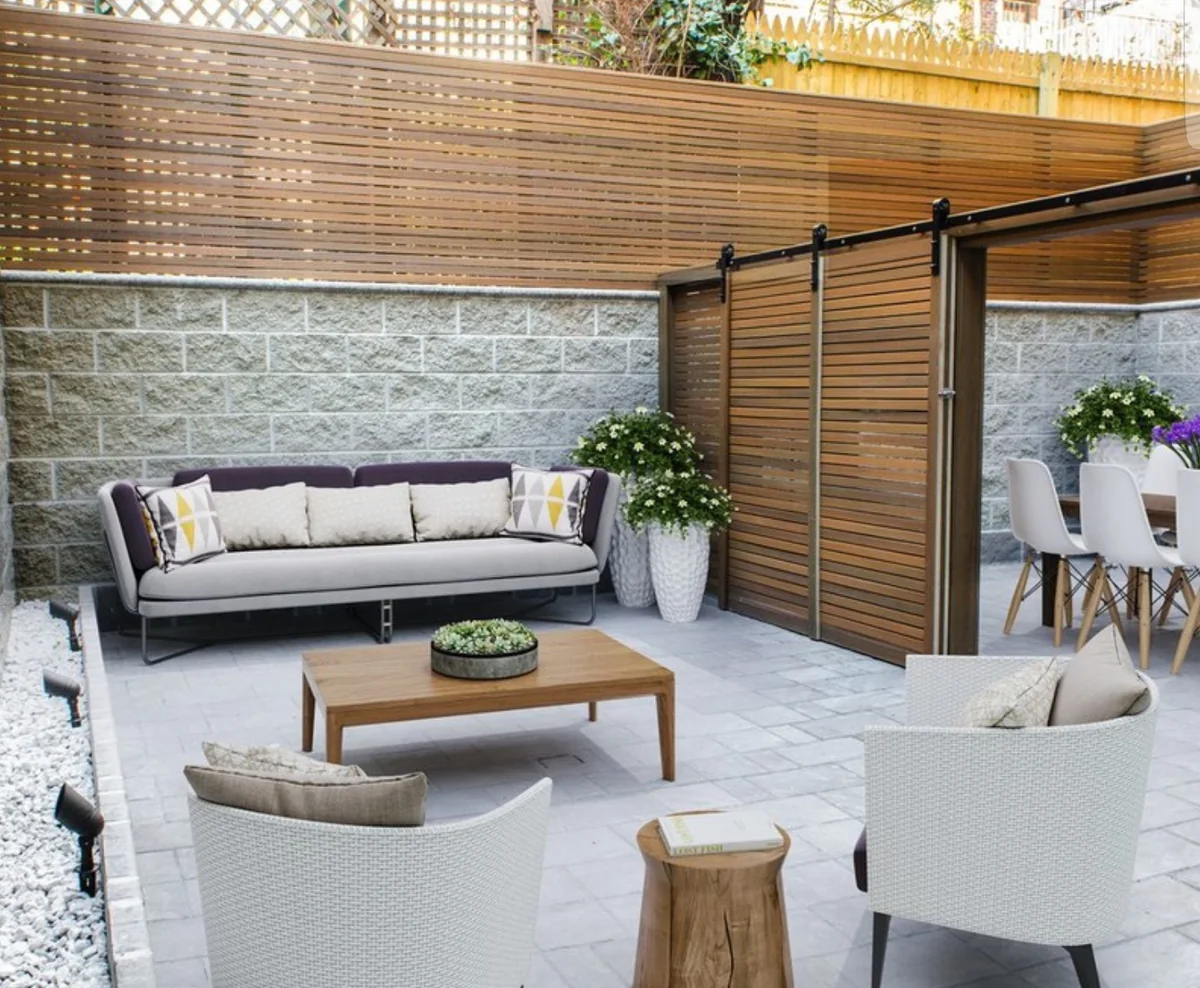 Patio lounge with paving, outdoor seating and privacy screening