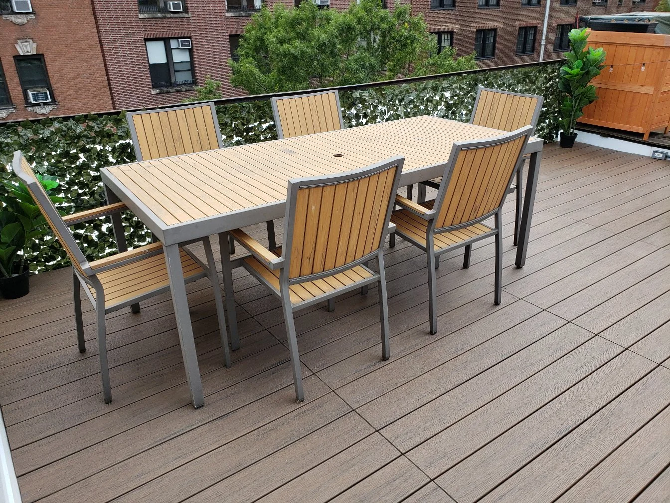 Manhattan modular rooftop TimberTech deck with dining area and planted screening