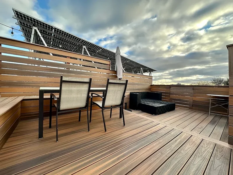 A counter, integrated seating and horizontal screening share a consistent material palette.