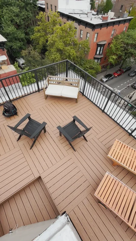 Alternating board directions give a rooftop seating area its rhythm.